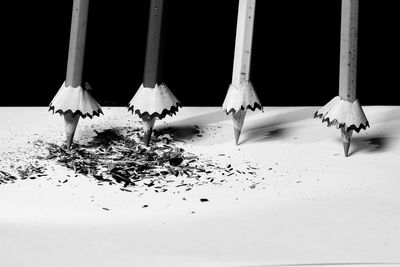 Close-up of snow on floor against white background