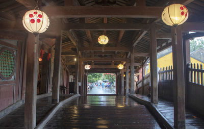 Illuminated lanterns hanging in building