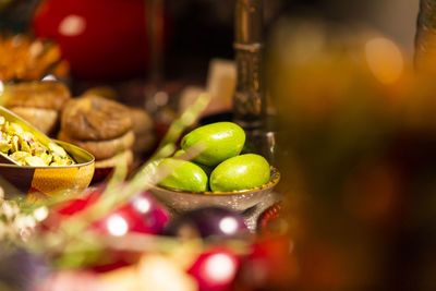 Close-up of green fruits on table at market