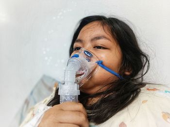     girl is receiving nasal spray, respiratory disease