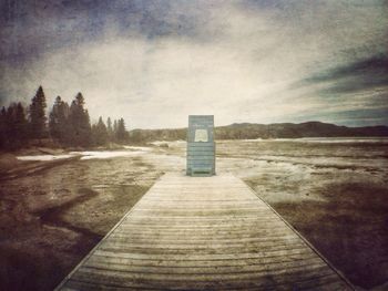 Scenic view of landscape against cloudy sky