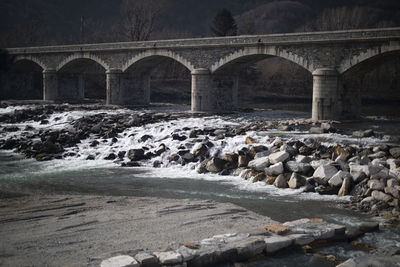 Arch bridge over river