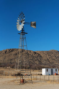 Windmill on a farm in the erongo mountains, namibia