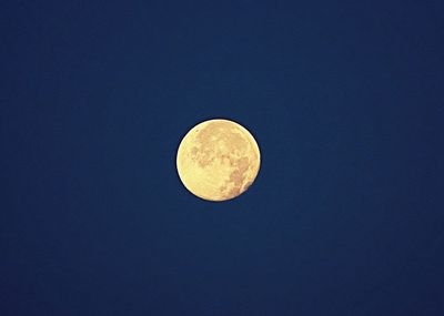 Low angle view of moon against sky at night