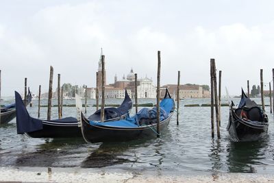 Boats moored in canal