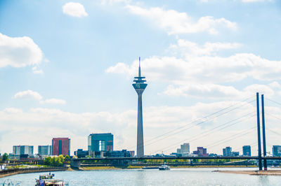 View of suspension bridge against cloudy sky