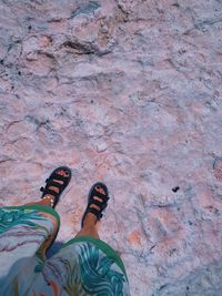 Low section of woman standing on ground