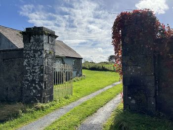 House on field against sky, onward 