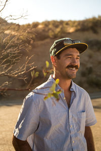 Portrait of young man standing outdoors