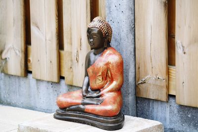 Statue of buddha outside building