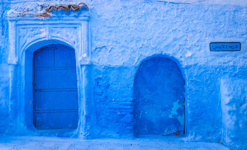 Close-up of blue door on building