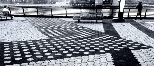 People standing on sidewalk