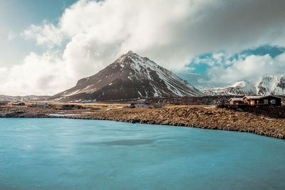 Scenic view of snowcapped mountains against sky