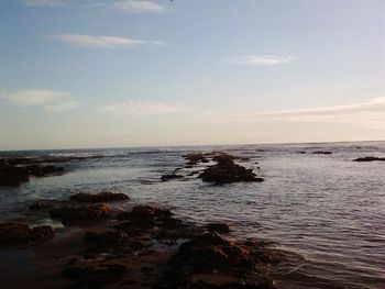 Scenic view of sea against sky at sunset