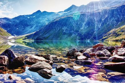 Aerial view of lake and mountains against sky