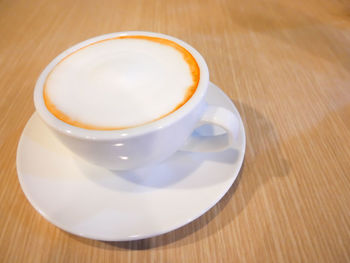 High angle view of cappuccino on table