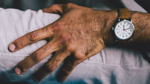 Close-up of human hand against blurred background