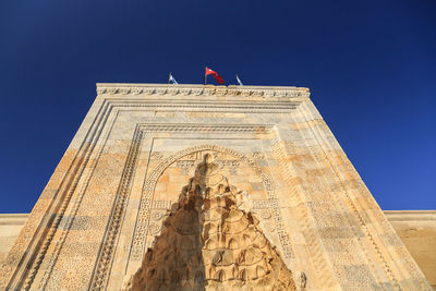 Low angle view of bell tower against sky