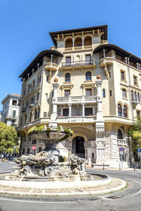 Low angle view of building against clear blue sky