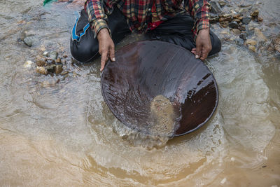 High angle view of man swimming in water