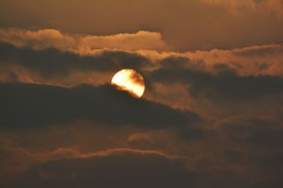 Low angle view of moon at sunset