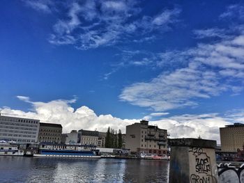 Buildings in city against sky