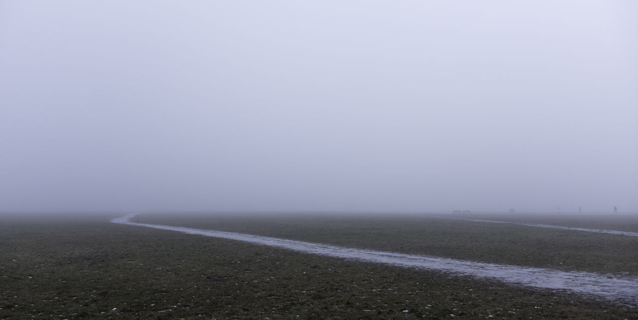 ROAD BY FOG AGAINST SKY