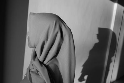 Close-up of hands on the window at home