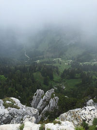 Scenic view of mountains in foggy weather