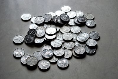 High angle view of coins on table