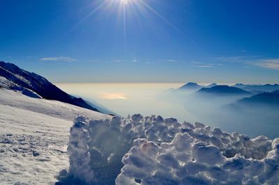 Scenic view of mountains against sky during winter