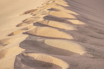 High angle view of shadow on sand