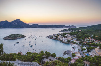 High angle view of sea against sky at sunset