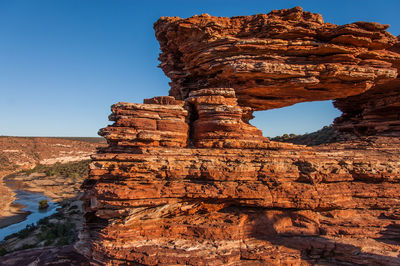 Low angle view of rock formation against clear sky