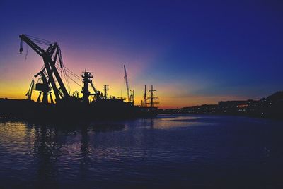 View of harbor at sunset