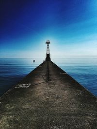 Scenic view of sea against blue sky