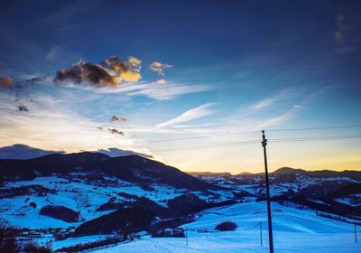 Scenic view of mountains against sky during winter