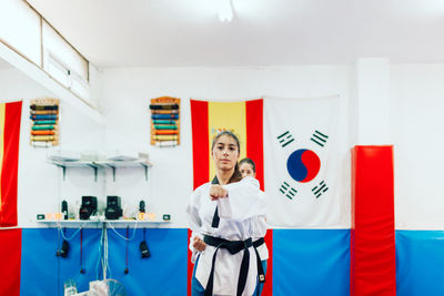 Woman practicing karate at health club