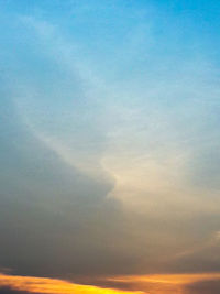 Scenic view of rainbow against sky at sunset