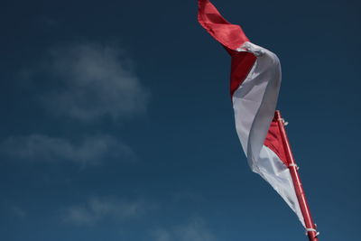 Low angle view of flag against sky