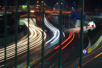 High angle view of light trails on road at night