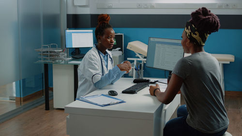 Doctor and patient talking in clinic