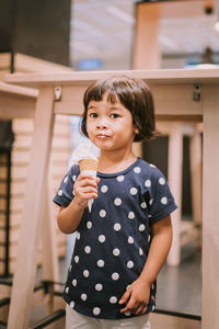 Portrait of girl holding ice cream