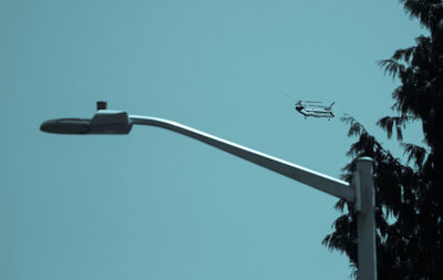 Low angle view of street light against clear sky