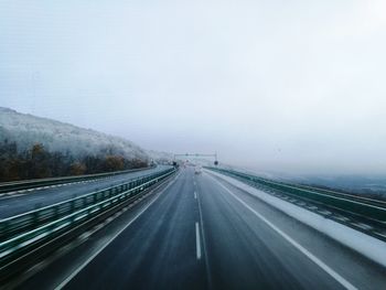 Highway against sky during winter