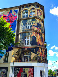 Low angle view of building against blue sky
