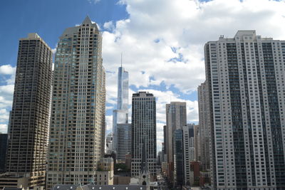 Low angle view of modern buildings against sky