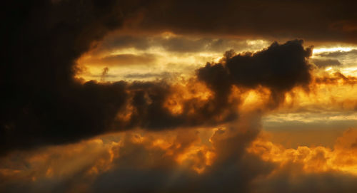 Low angle view of dramatic sky during sunset