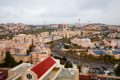 High angle view of buildings in city against sky