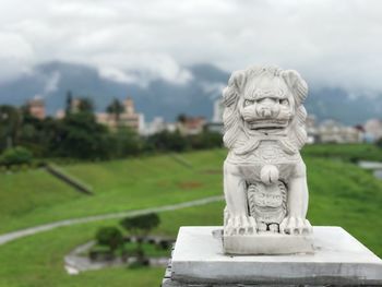 Close-up of statue against sky